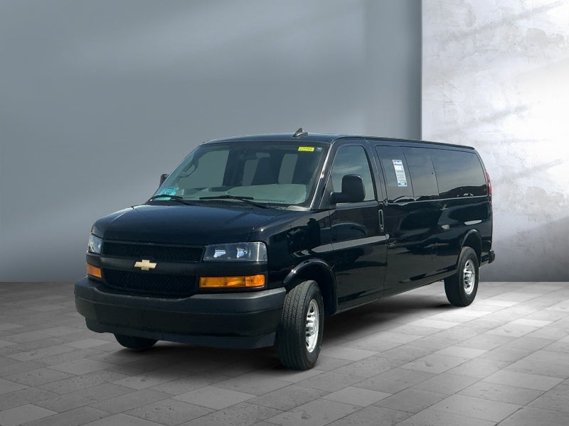 2025 Chevrolet Express Passenger LS in Black — front three-quarter view