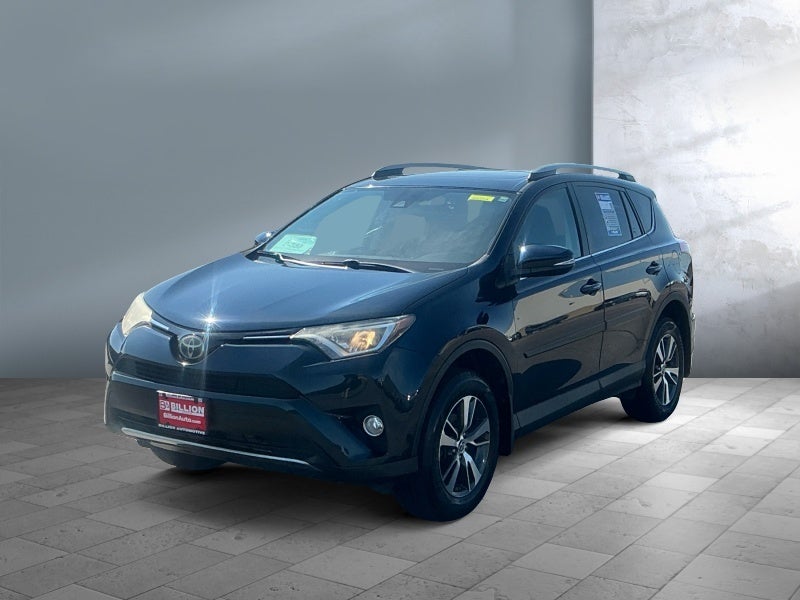 2017 Toyota RAV4 XLE in Galactic Aqua Mica — front three-quarter view