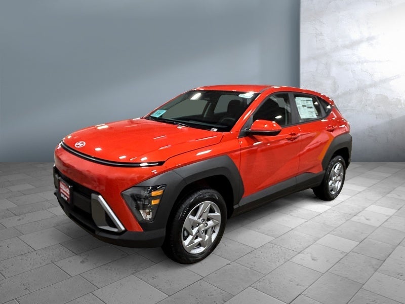2026 Hyundai KONA SE in Soultronic Orange Pearl — front three-quarter view