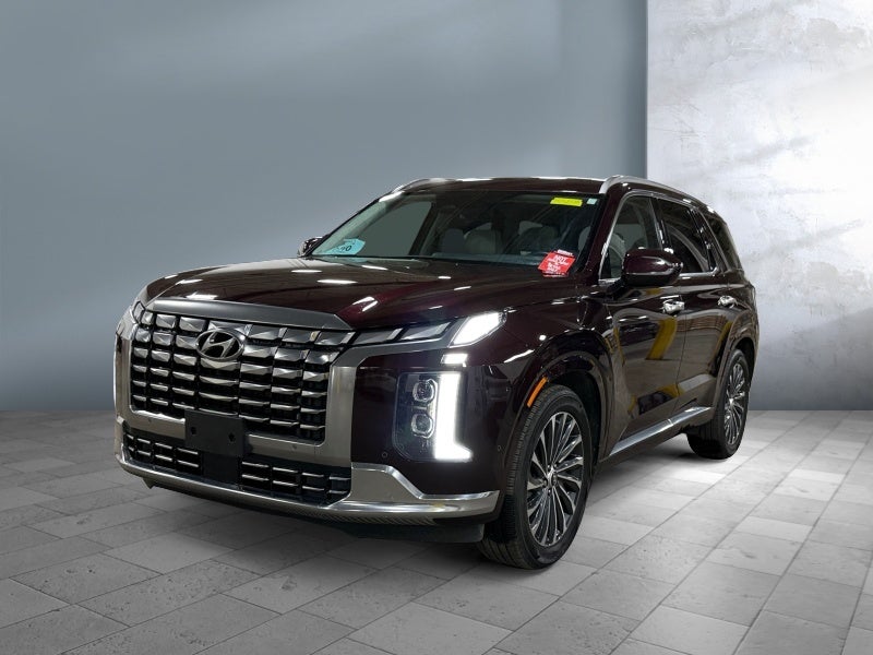 2023 Hyundai PALISADE Calligraphy in Sierra Burgundy — front three-quarter view