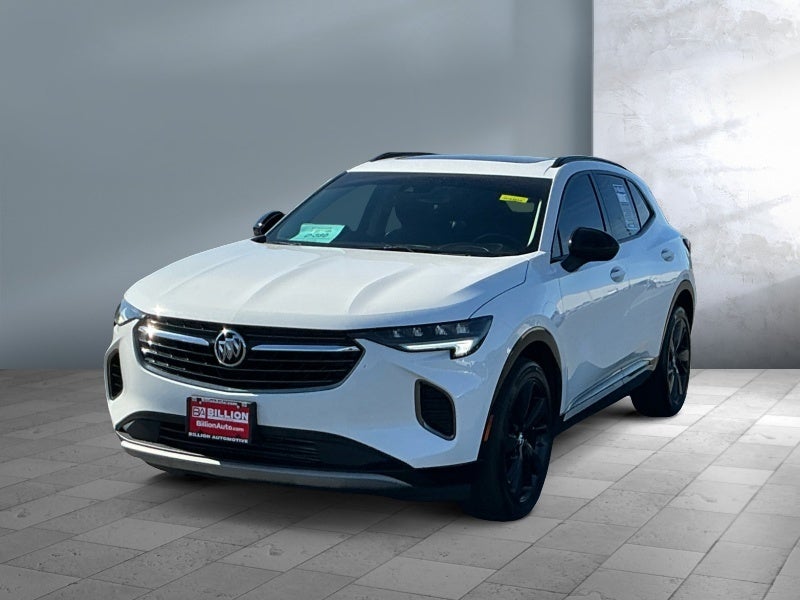2023 Buick Envision Essence in Summit White — front three-quarter view